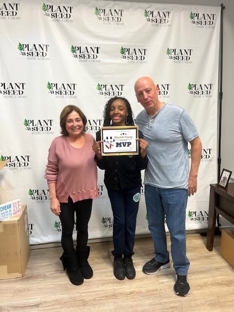 Founders Michele & Gene Rice with scholarship recipient Odin