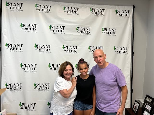 Founders Michele & Gene Rice with scholarship recipient Odin