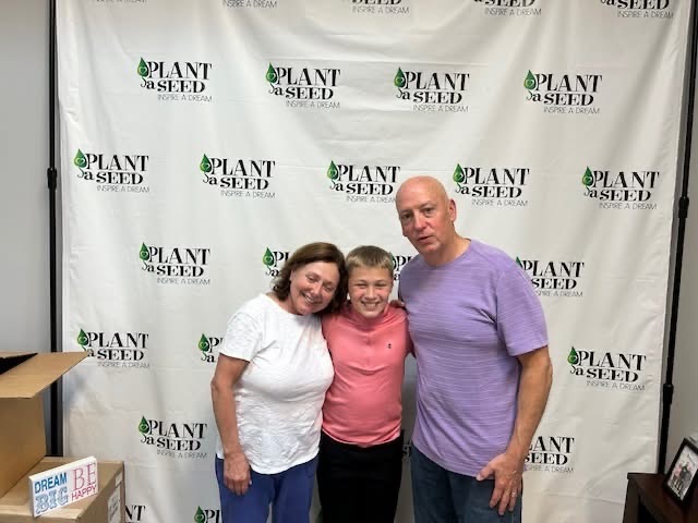 Founders Michele & Gene Rice with scholarship recipient Odin